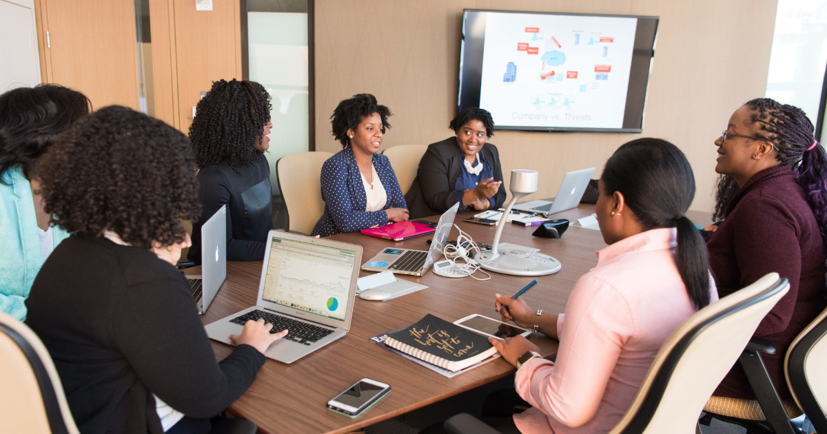 Team of women pitch best-in-class sales presentations