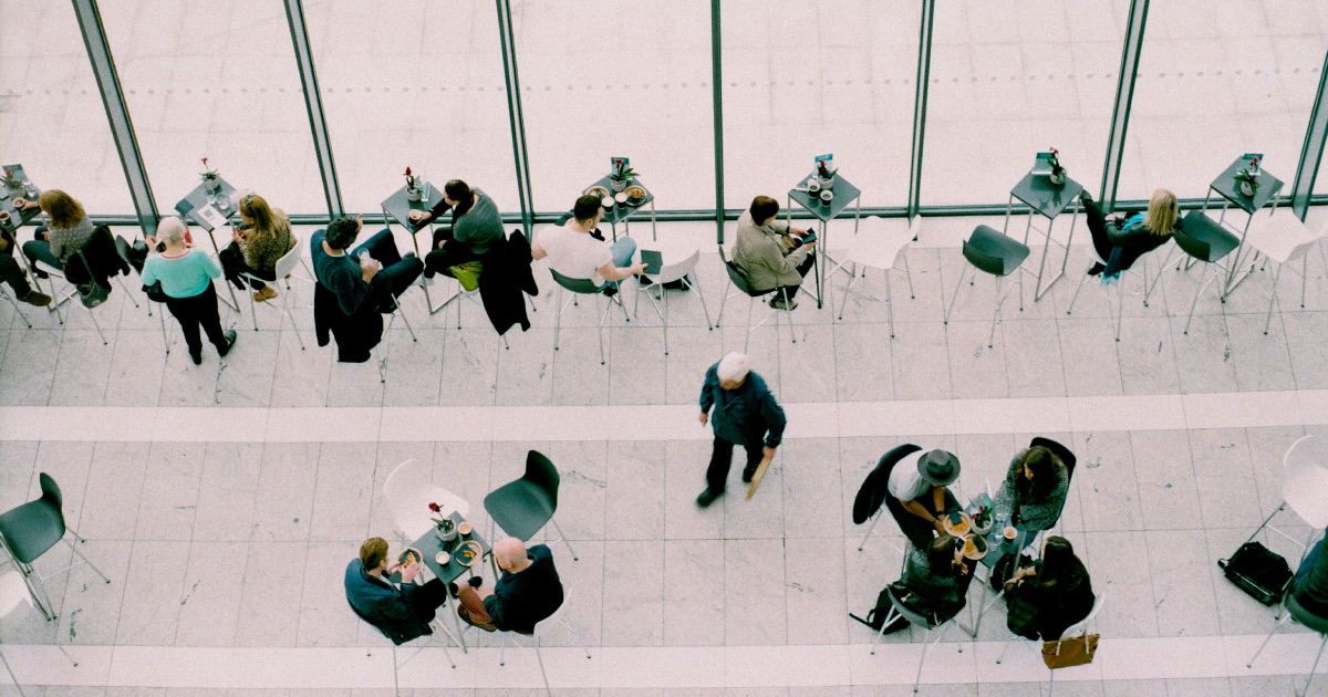 Overhead view of people sitting at tables