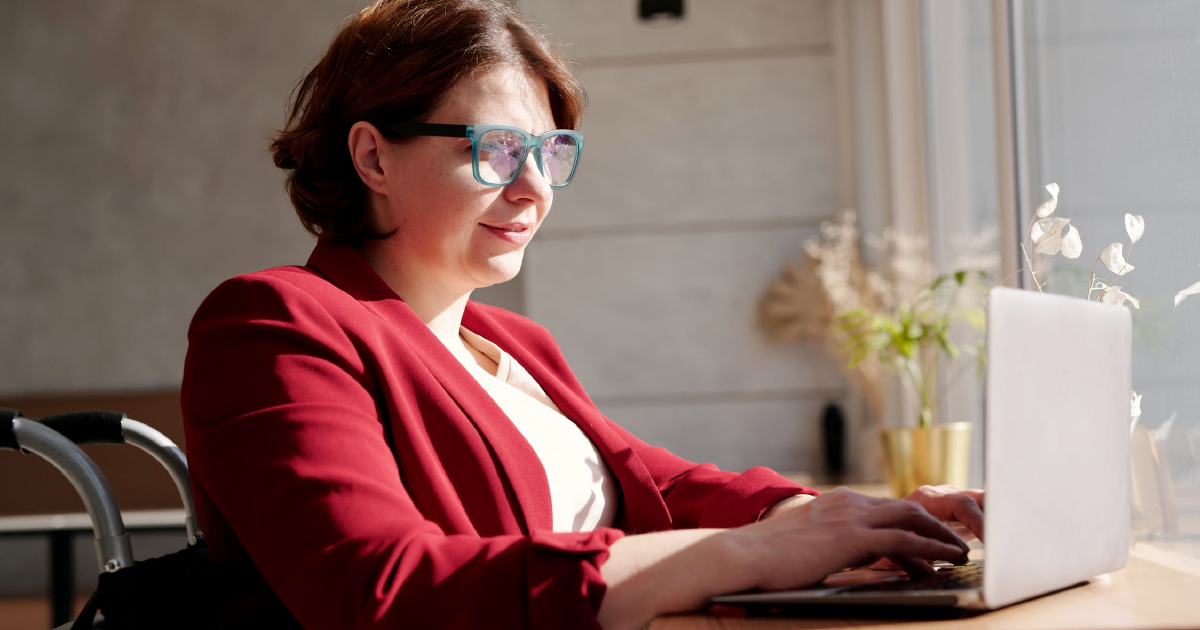 Sales leader looks at computer