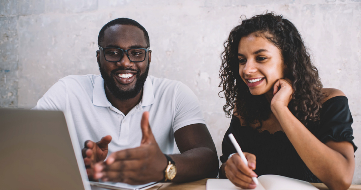 Two enablement practitioners smiling