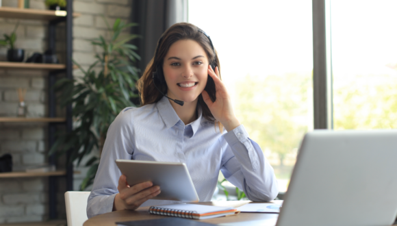 Salesperson with tablet and computer