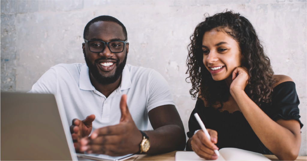 Two enablement practitioners smiling