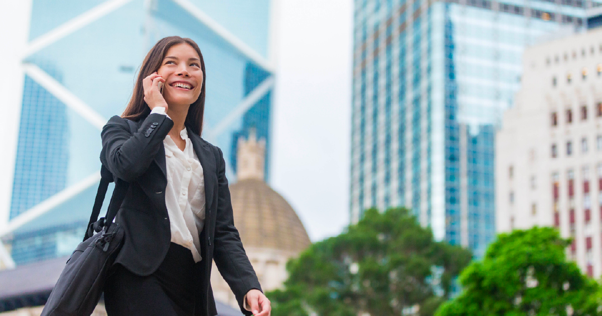 Person smiles while talking on cellphone