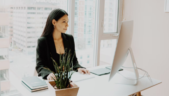 Person in office looking at computer screen