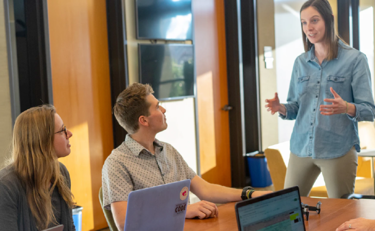 Three people discuss sales methodology