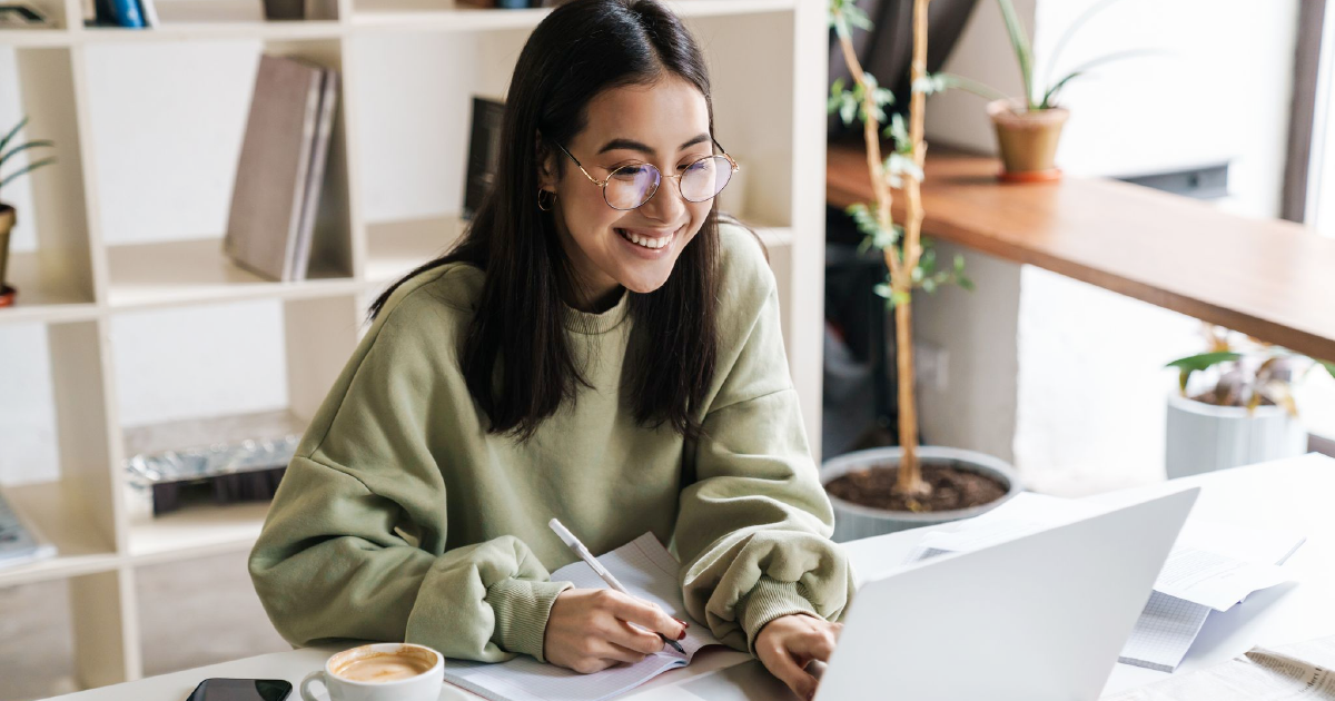 Person smiles at computer